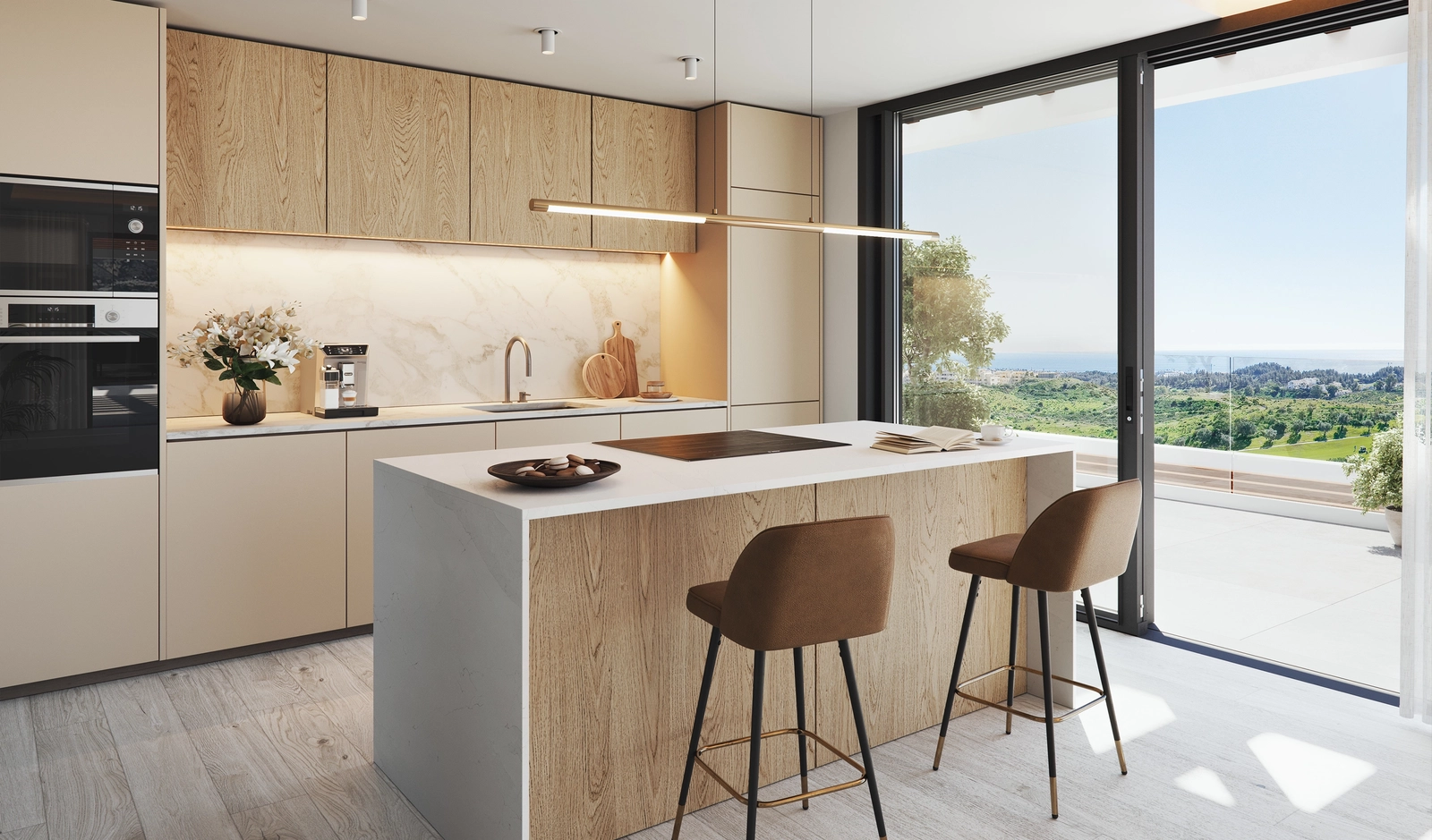 Una cocina moderna con electrodomésticos de primera calidad y vistas abiertas a Mijas y al paisaje circundante.