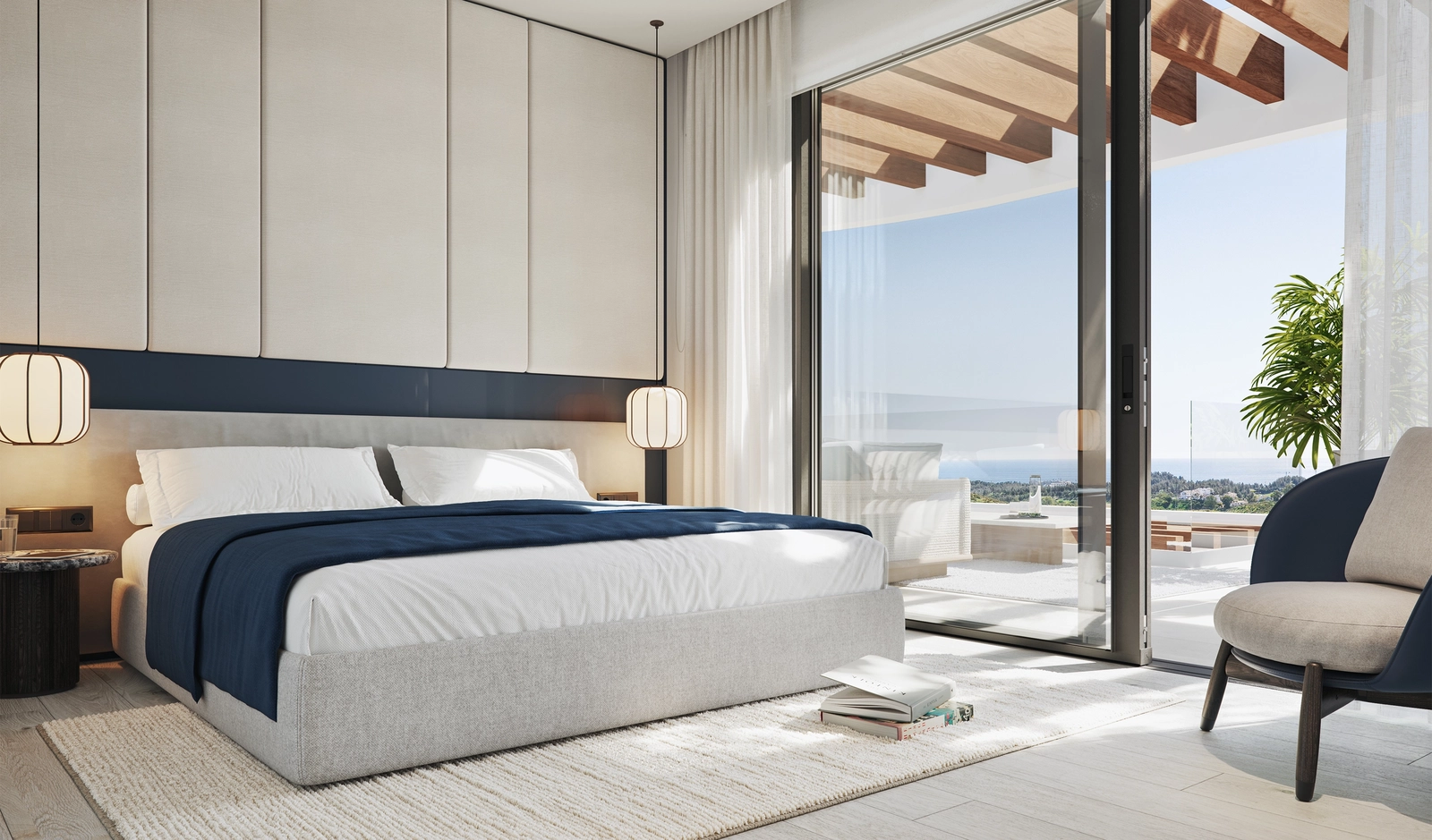 Tranquila suite principal con luz suave, vistas abiertas al mar y total confort.