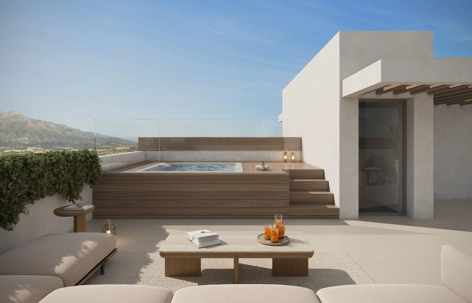 Su solárium privado en la azotea, un espacio ideal para relajarse en el jacuzzi con vistas a las montañas.