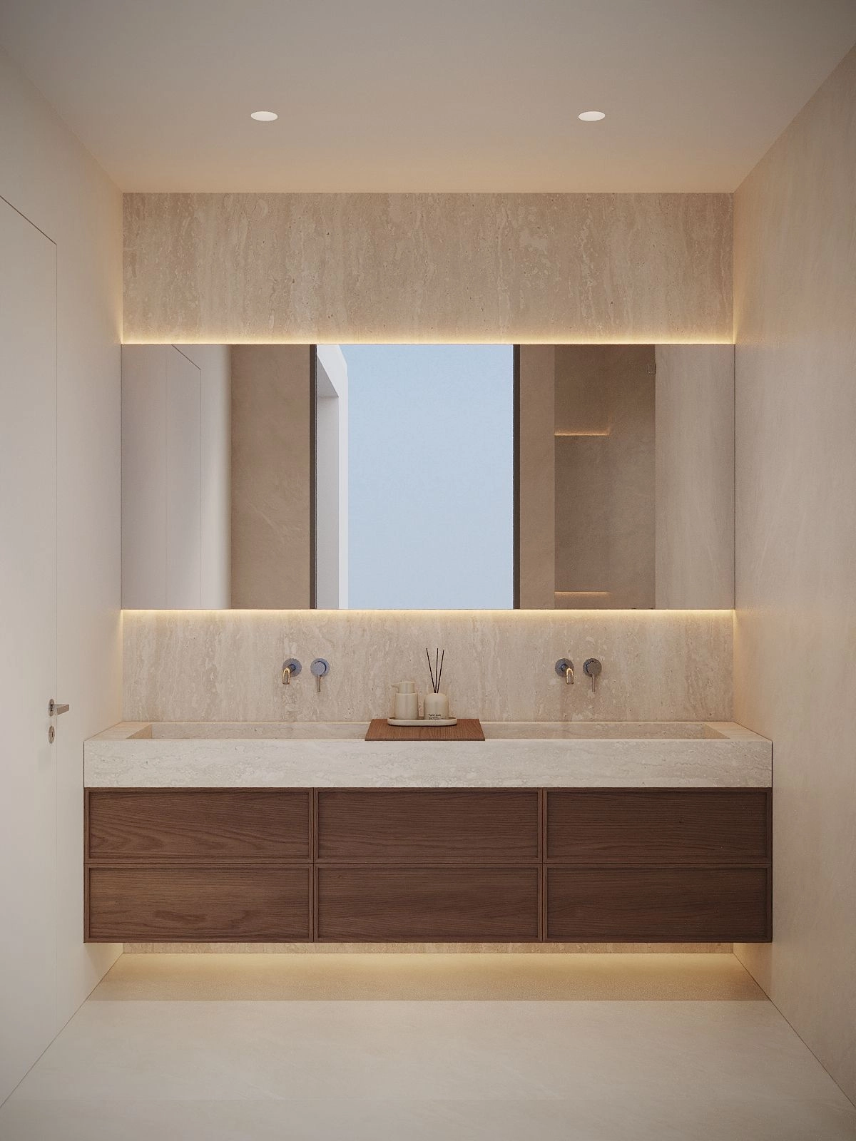 Elegante baño principal con un moderno lavabo doble y materiales naturales de primera calidad.