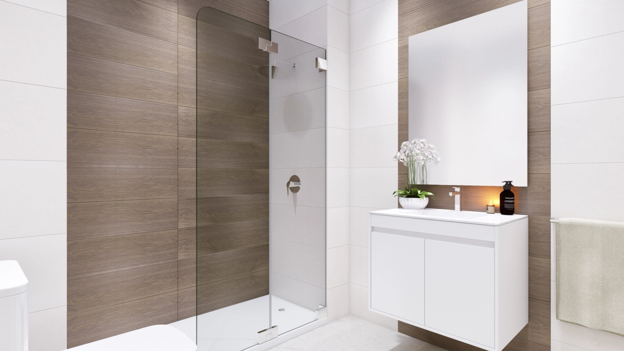 Un baño elegante y moderno con materiales de alta calidad y un diseño limpio y sofisticado.