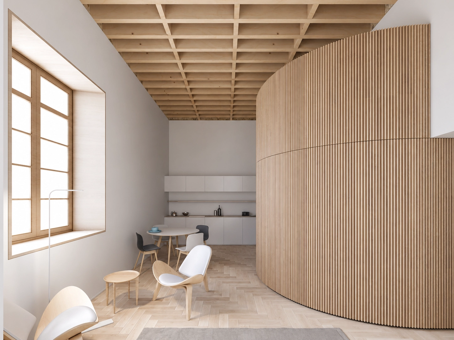 Una vista de la perfecta integración entre la cocina y las zonas de comedor, con un diseño limpio y madera natural.