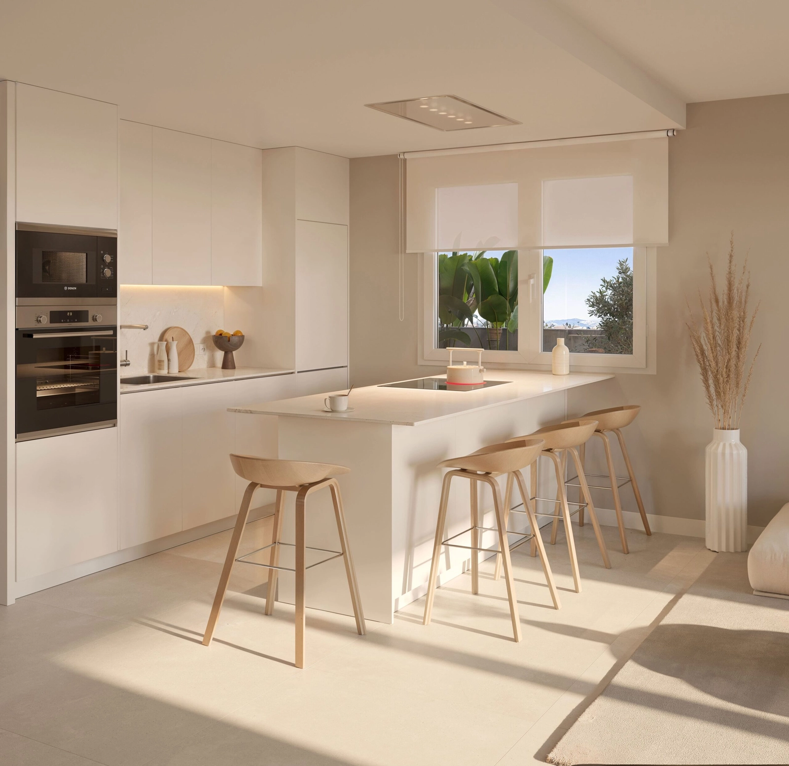 Una cocina moderna y elegante, totalmente equipada con electrodomésticos de alta calidad y una acogedora isla para desayunos.