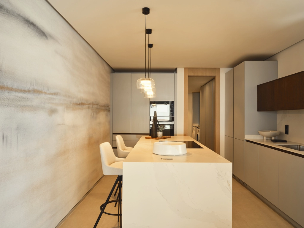 Una cocina de última generación con electrodomésticos de alta gama y un diseño minimalista, perfecta para la vida diaria y el entretenimiento.