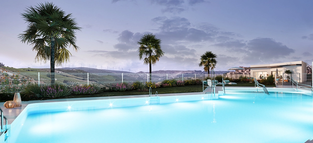 La piscina comunitaria ofrece un entorno tranquilo para la relajación, rodeada de preciosos jardines paisajísticos.