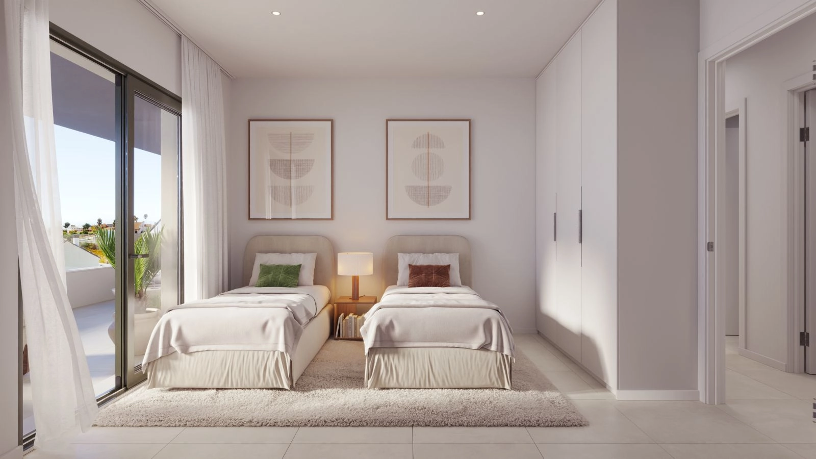 Un cómodo dormitorio de invitados diseñado con colores serenos y abundante luz natural.