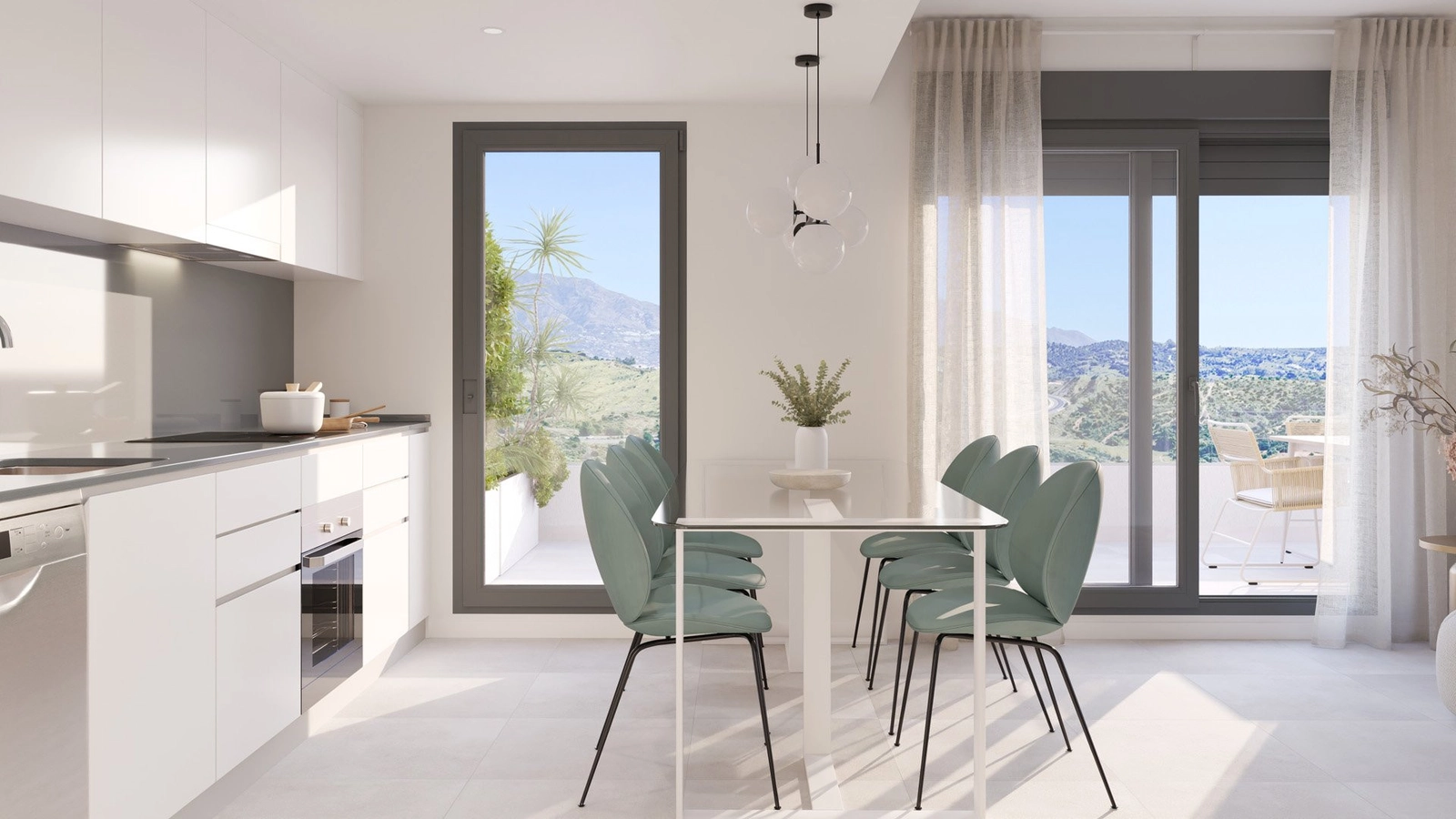 Una vista de la moderna cocina y el comedor, con acceso a una terraza con vistas a la montaña.