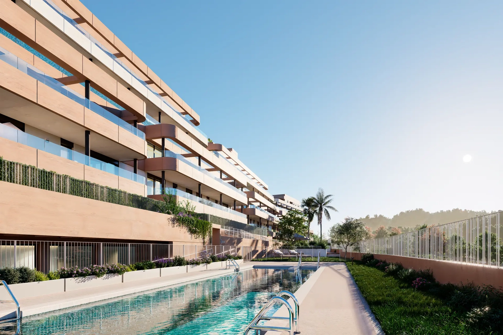 La piscina principal se encuentra en jardines paisajísticos, ofreciendo un oasis de tranquilidad para el disfrute de los residentes.