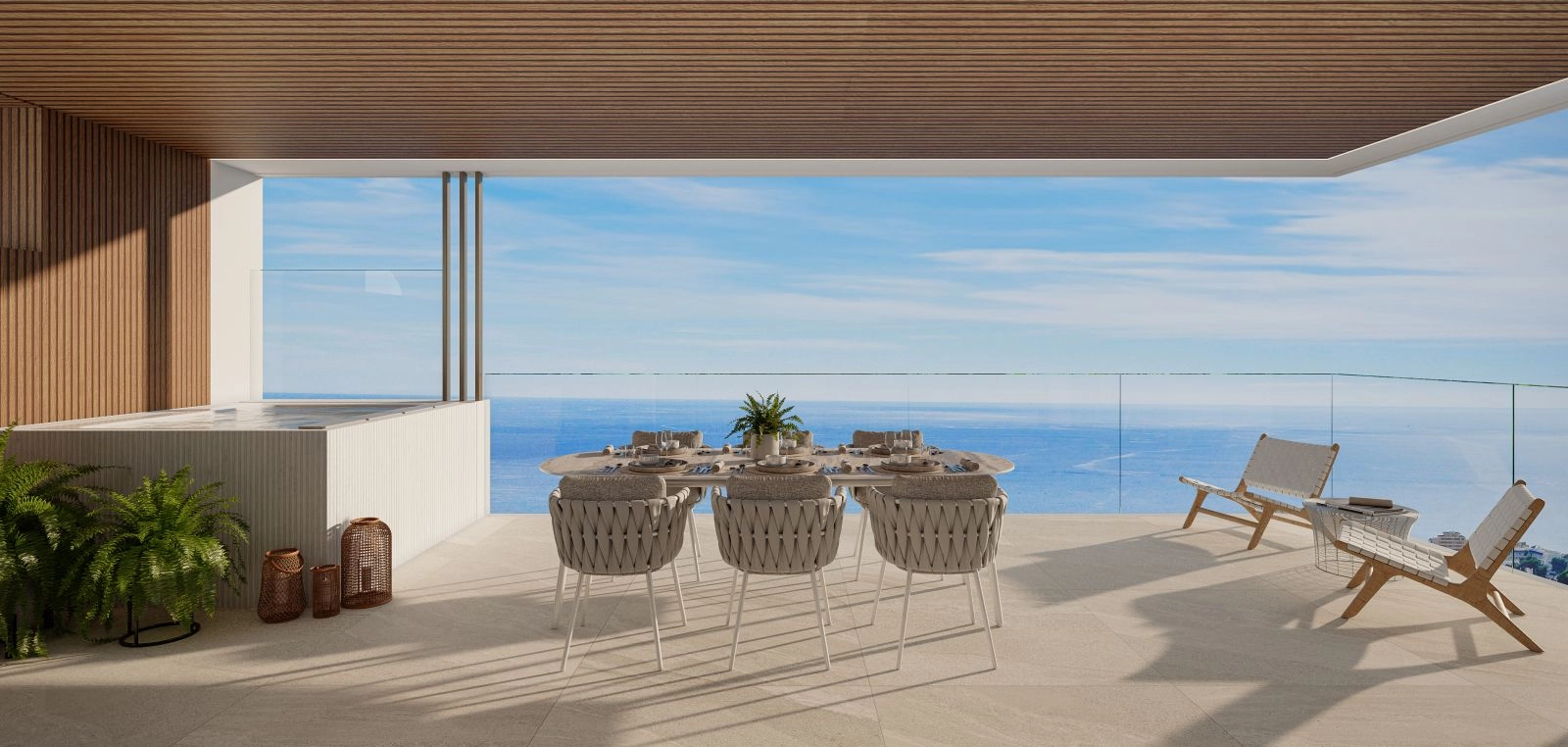 Una amplia terraza privada con jacuzzi, que ofrece magníficas vistas al mar sobre la Costa del Sol.