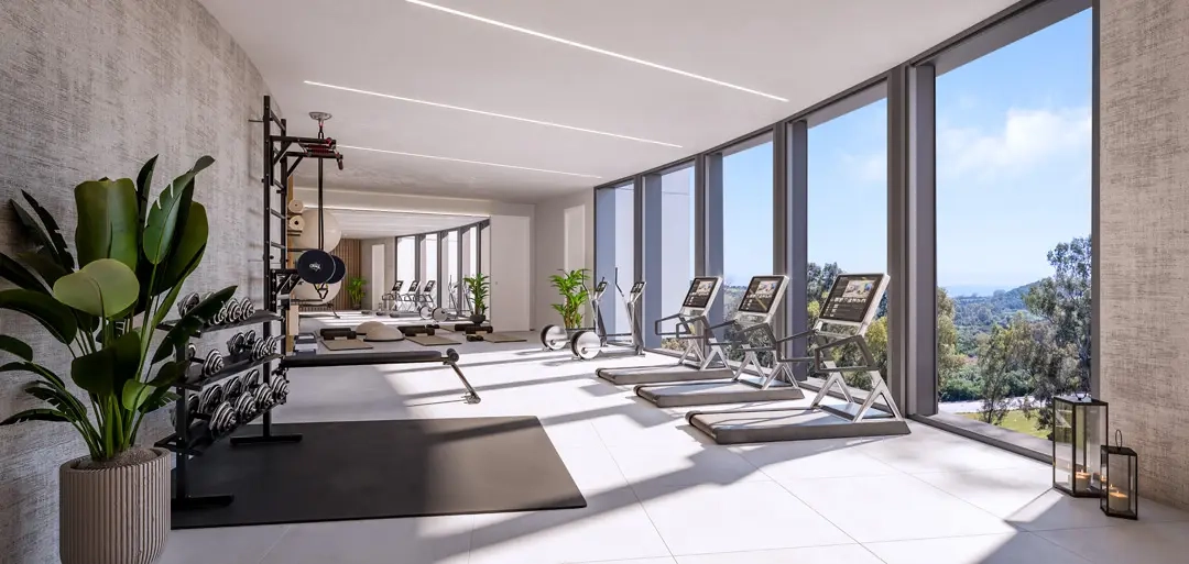 Manténgase activo en el gimnasio completamente equipado con vistas a la naturaleza circundante.