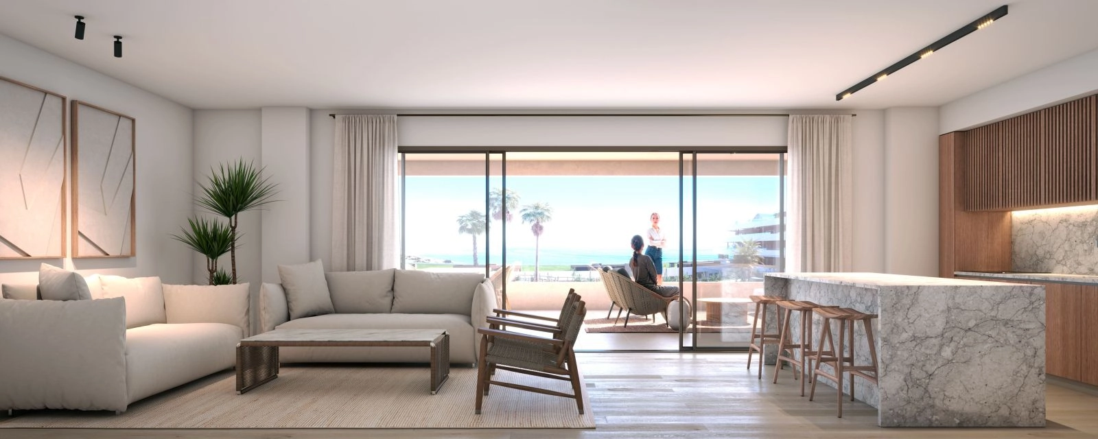 La cocina de planta abierta y la zona de estar, diseñadas para una vida moderna y una perfecta conexión entre el interior y el exterior.