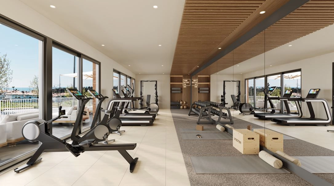 Un gimnasio de última generación con equipamiento moderno para mantener un estilo de vida saludable y activo.
