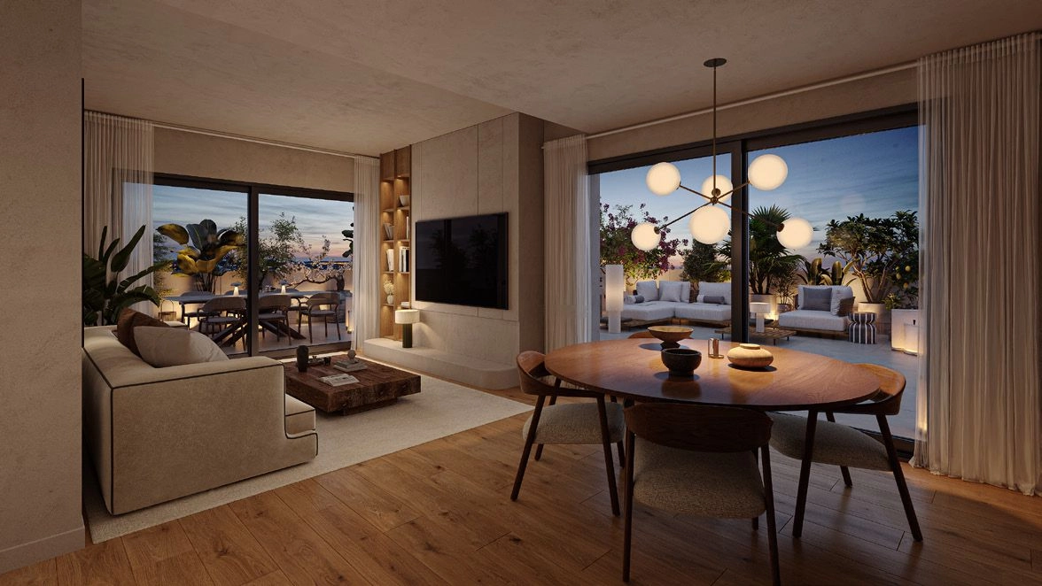 Elegantes espacios de salón se integran a la perfección con la terraza, inundados de luz natural mediterránea.