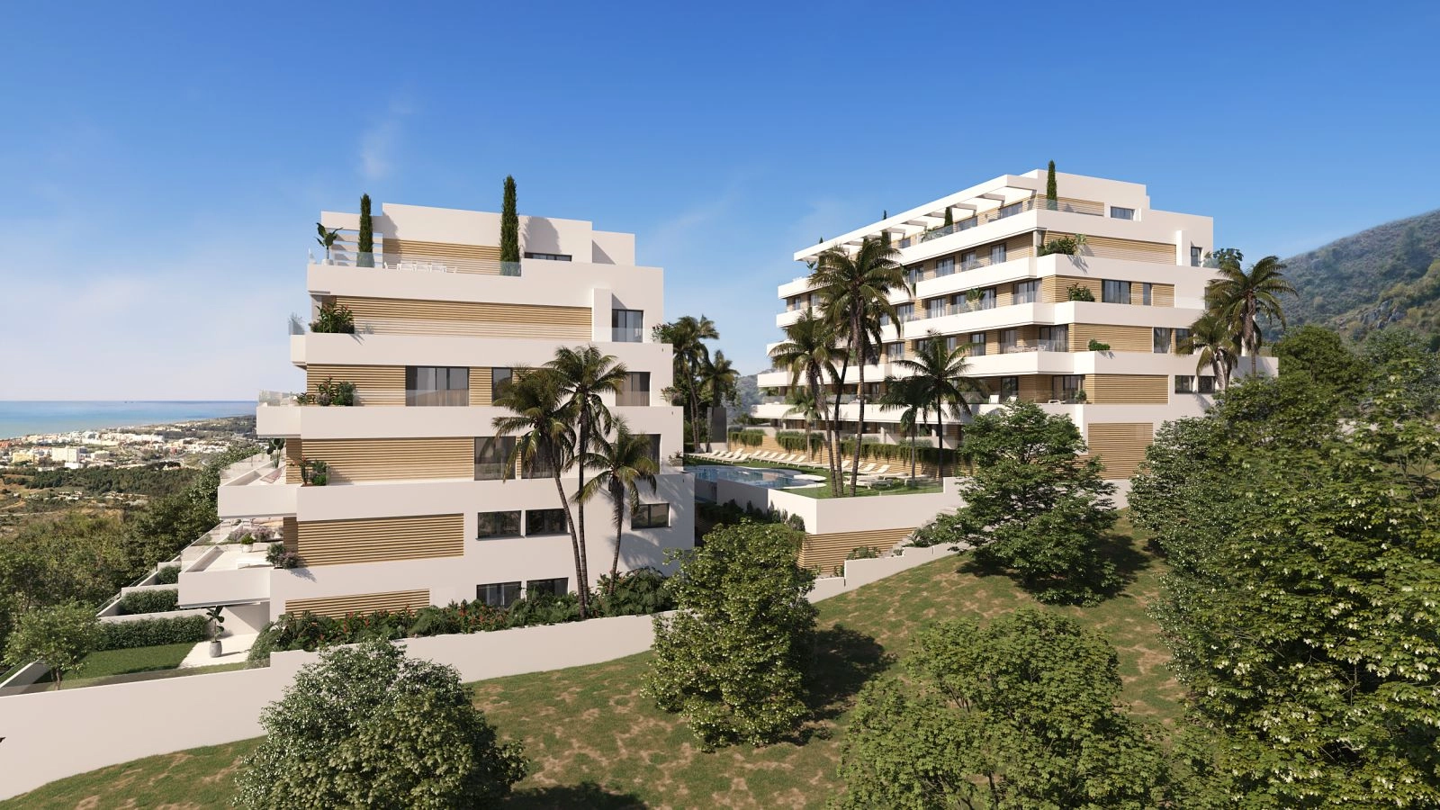 Una vista elevada del moderno complejo residencial, mostrando su impresionante arquitectura y vistas hacia el mar Mediterráneo.
