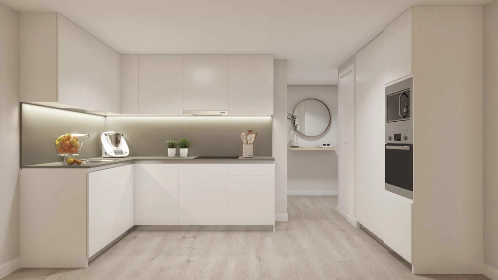 La cocina moderna de planta abierta está totalmente equipada y diseñada con líneas limpias y acabados de alta calidad.