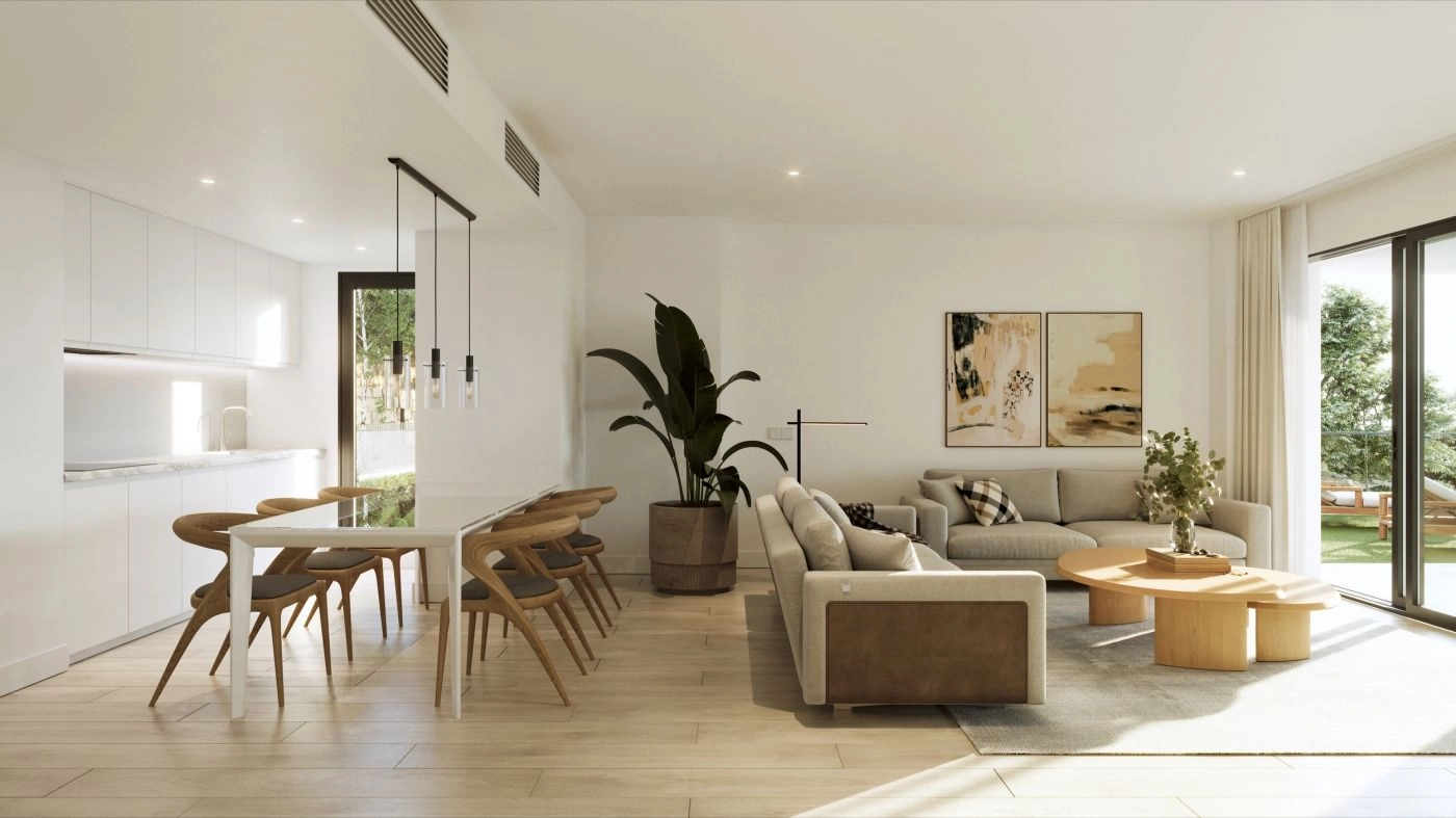 Espacios de salón y comedor de planta abierta que se extienden sin esfuerzo al exterior.