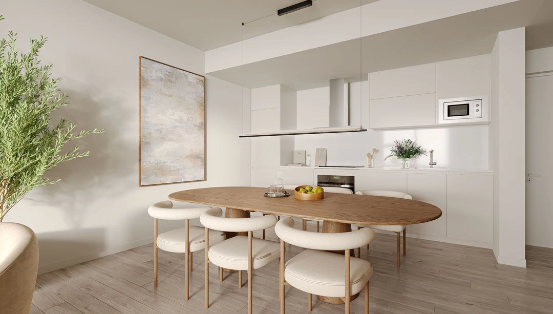 Una cocina moderna de concepto abierto y zona de comedor, completamente equipada con electrodomésticos de alta calidad.