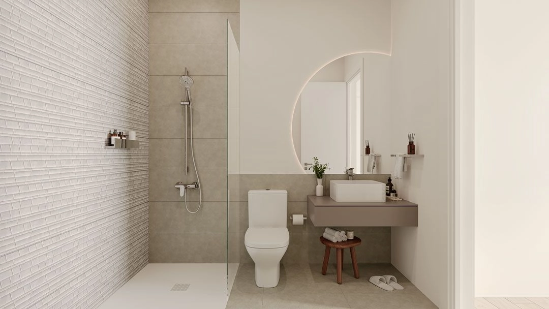 Un elegante baño con accesorios contemporáneos y materiales de alta calidad para una sensación de spa.