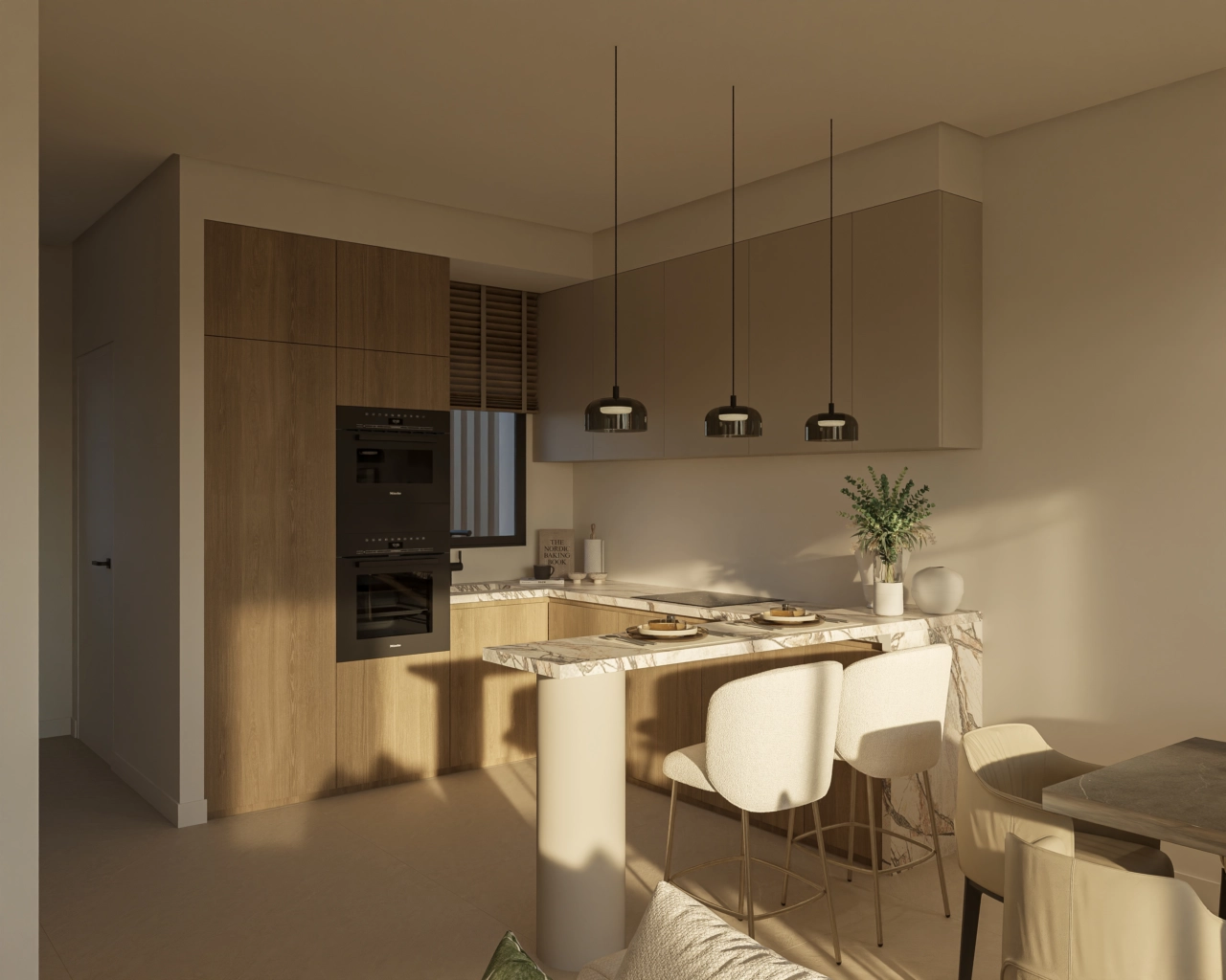 Una cocina moderna con acabados elegantes y una práctica barra de desayuno.