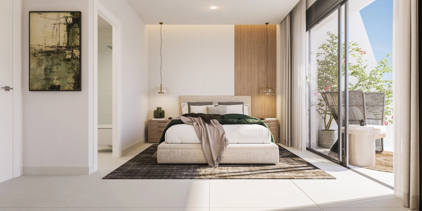 El dormitorio principal es un refugio de paz, lleno de luz natural y con acceso directo a una terraza exterior.