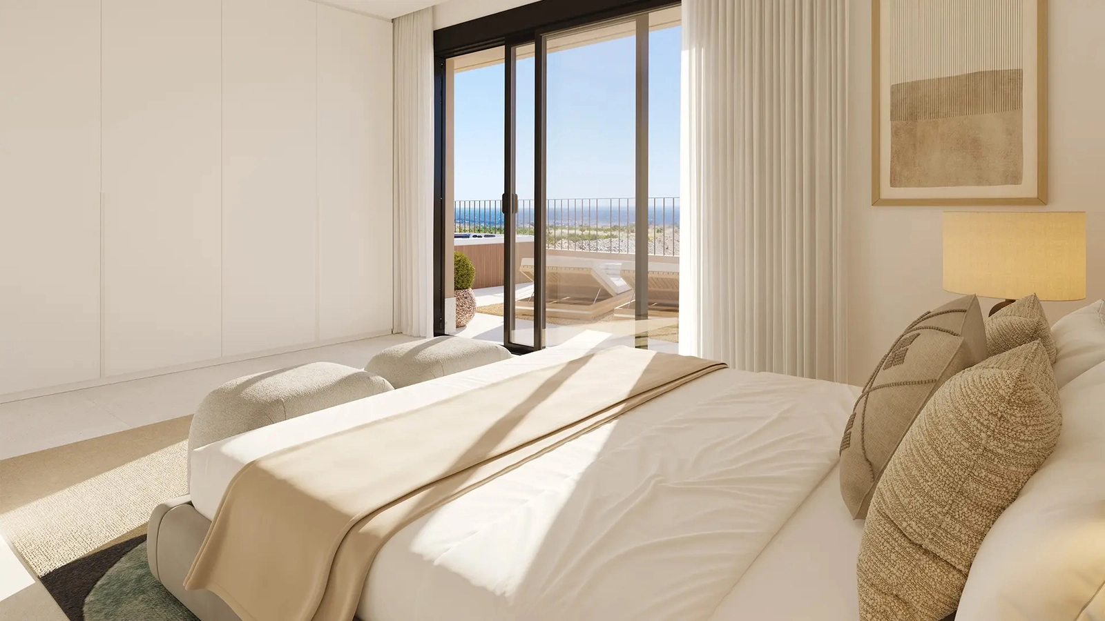 Dormitorio principal con luz suave y vistas al mar, un espacio tranquilo para el descanso y el confort.