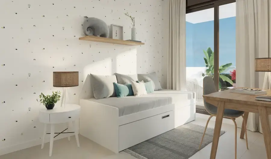 Un acogedor dormitorio secundario, lo suficientemente versátil como para ser una habitación de invitados, una habitación infantil o una oficina en casa.