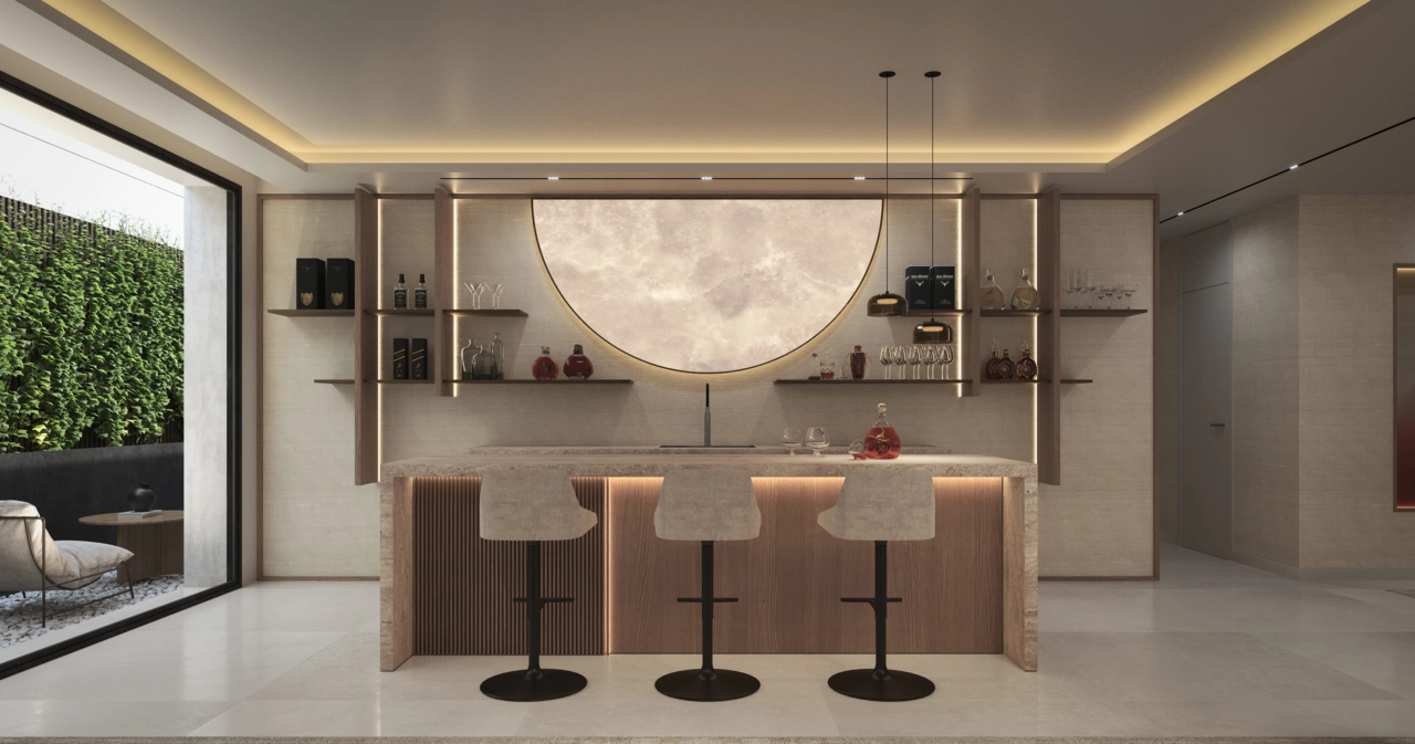 Una elegante zona de bar y salón en el sótano ofrece un espacio sofisticado para recibir a amigos y familiares.