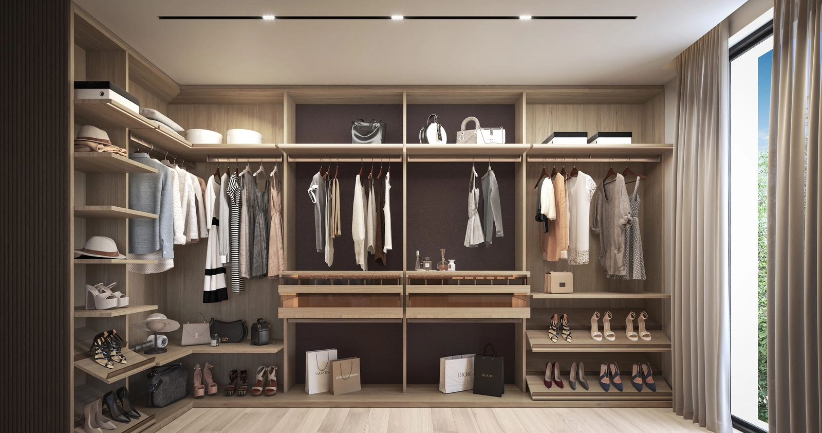 Un vestidor espacioso y bellamente diseñado ofrece amplio almacenamiento en un entorno elegante.