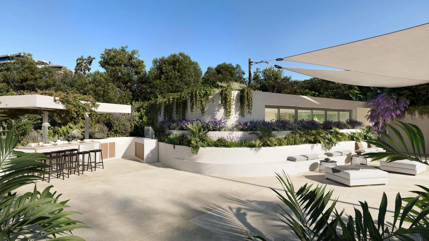 Un salón exterior y cocina con zona de barbacoa, perfecto para reuniones sociales y cenas al aire libre.