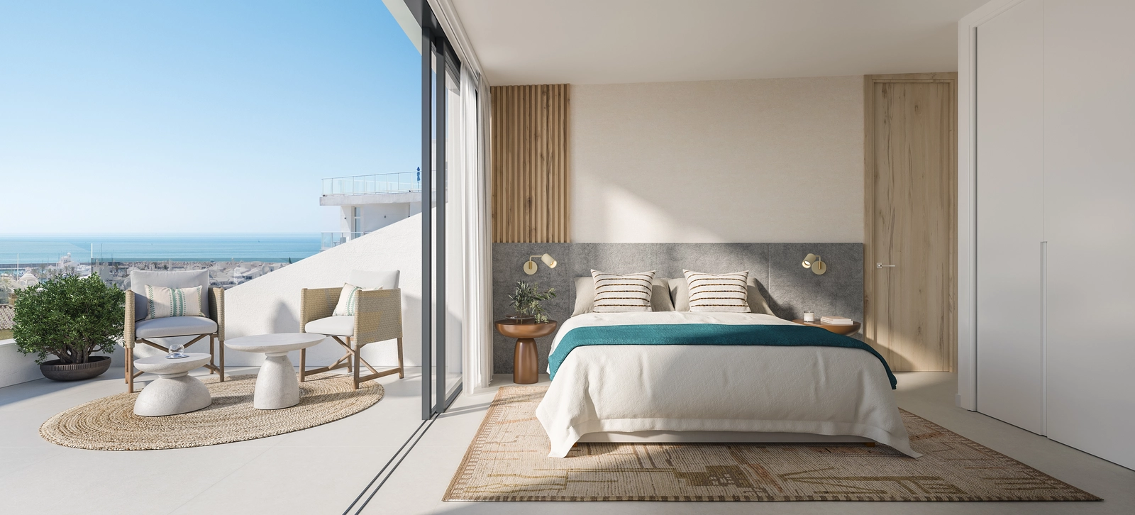 Un dormitorio luminoso y sereno con acceso directo a una terraza con preciosas vistas al mar.