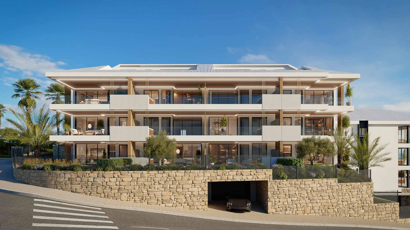 La arquitectura contemporánea de la promoción se integra a la perfección con el entorno natural.
