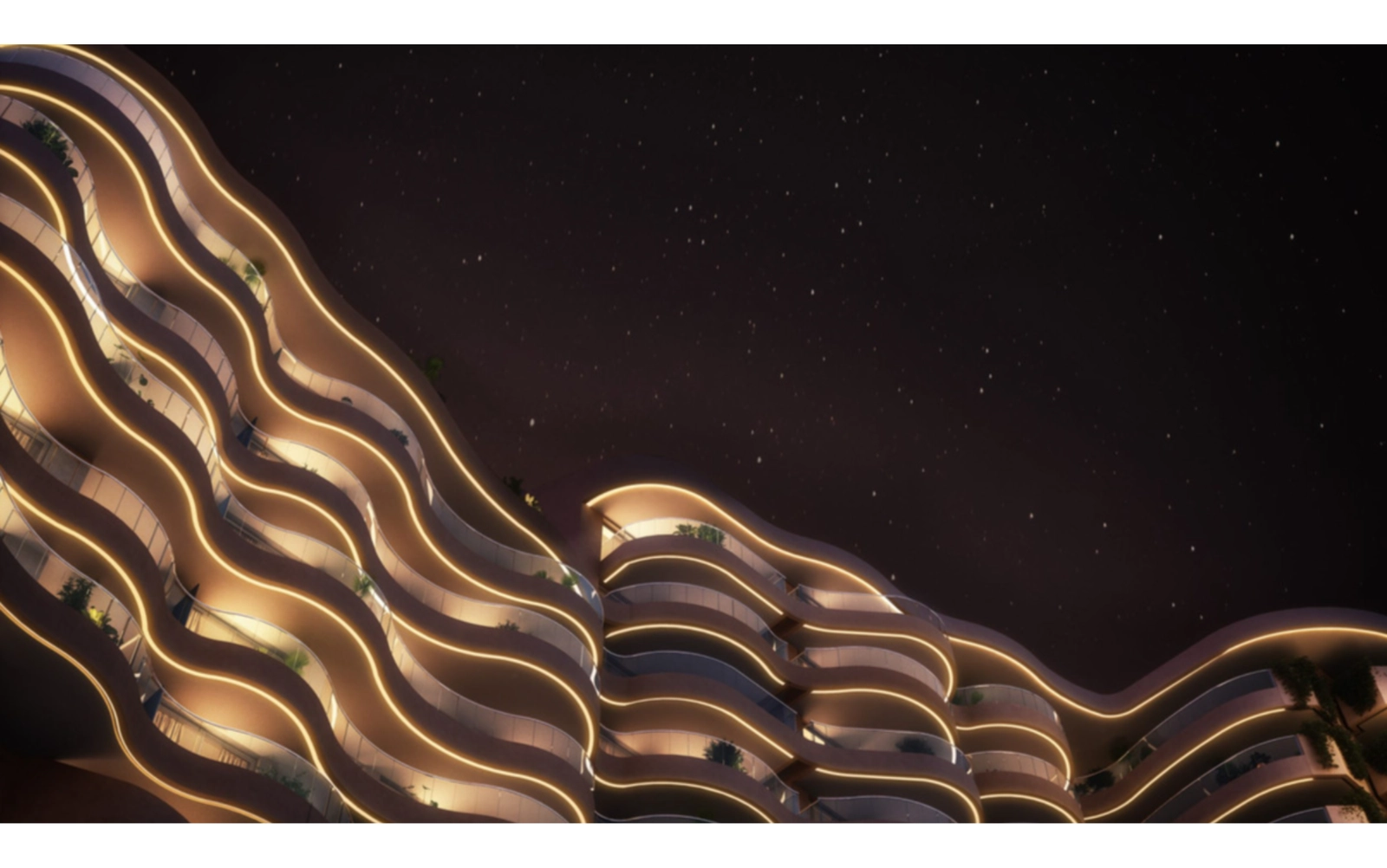 La distintiva arquitectura en forma de ola del edificio se ilumina bellamente por la noche.