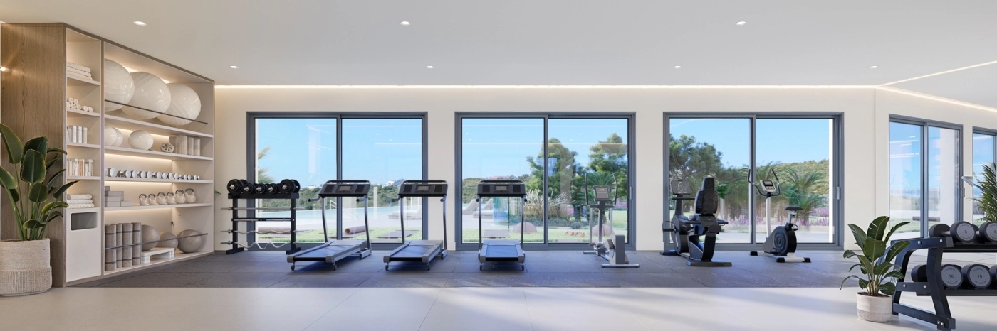 El gimnasio completamente equipado para residentes, con vistas inspiradoras para mejorar su entrenamiento.