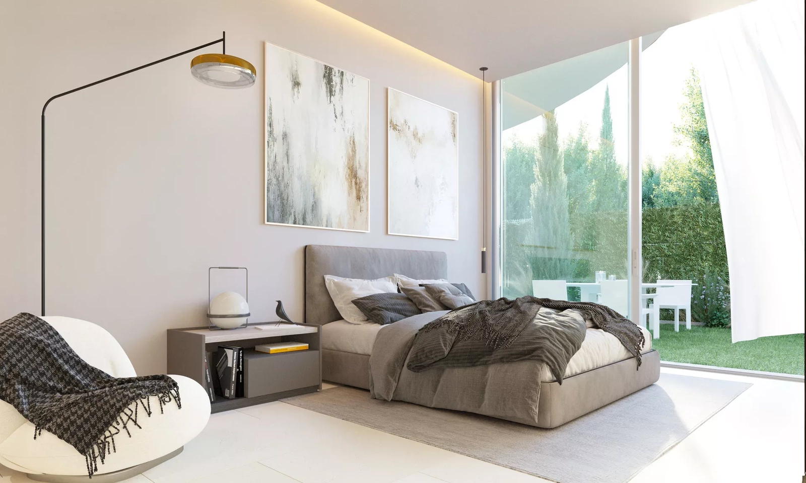 Un cómodo dormitorio con grandes puertas correderas de cristal que se abren directamente al jardín mediterráneo.