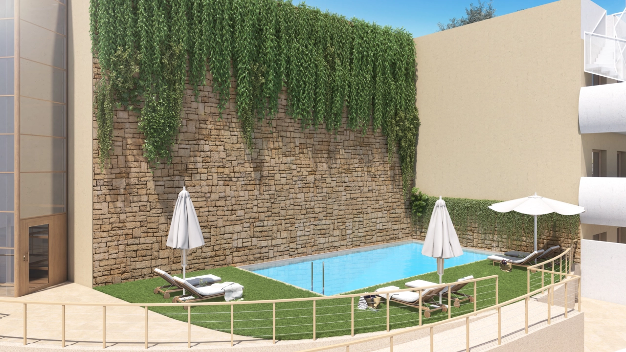 Una de las dos atractivas piscinas exteriores, situada en jardines comunitarios bellamente ajardinados.