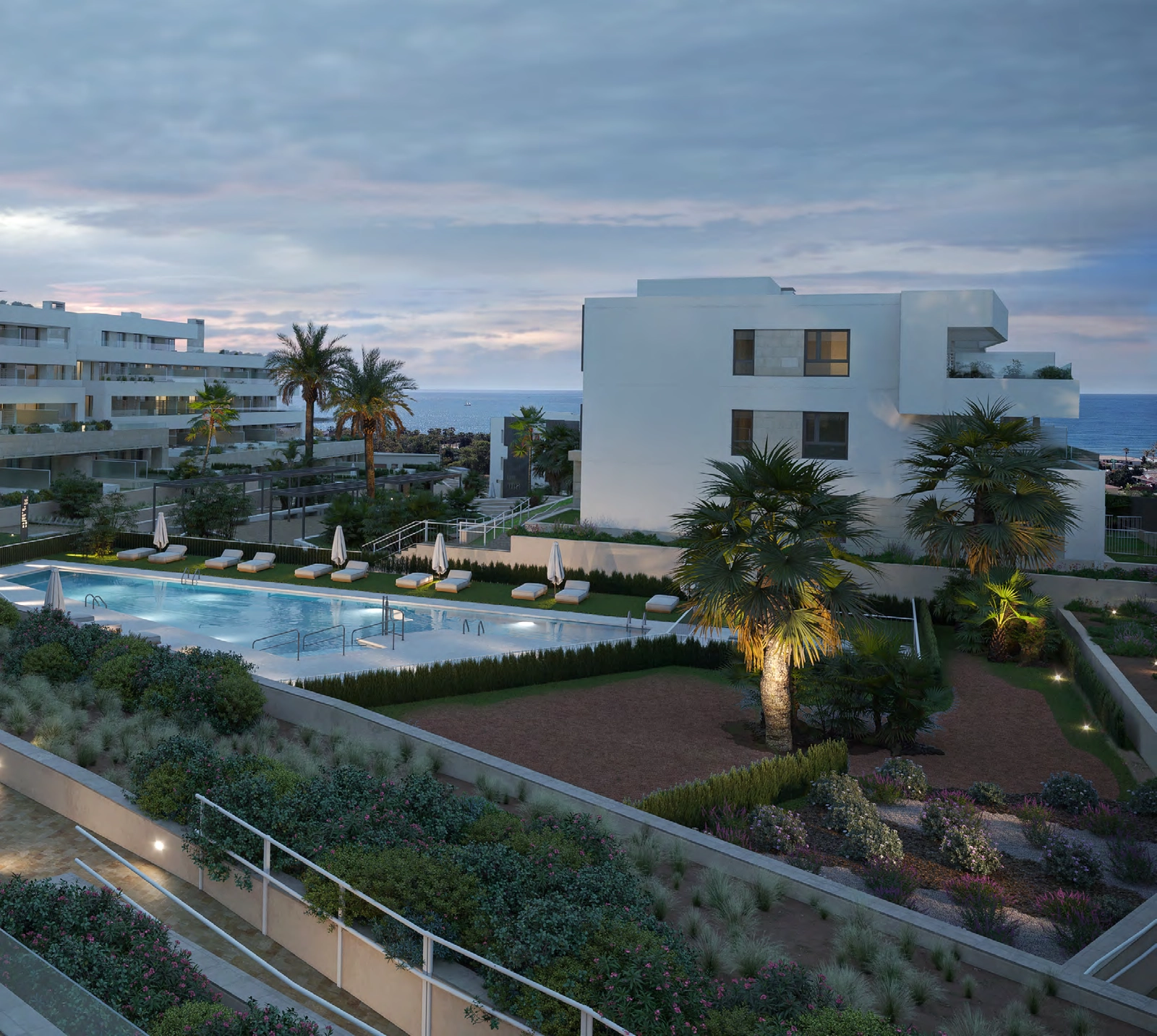 Al caer la tarde, el diseño de iluminación de la promoción crea un ambiente cálido y exclusivo.